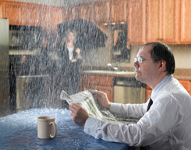 Leaking Roof onto man